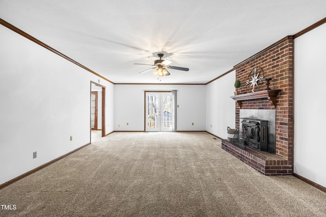 unfurnished living room featuring french doors, ceiling fan, carpet, and crown molding