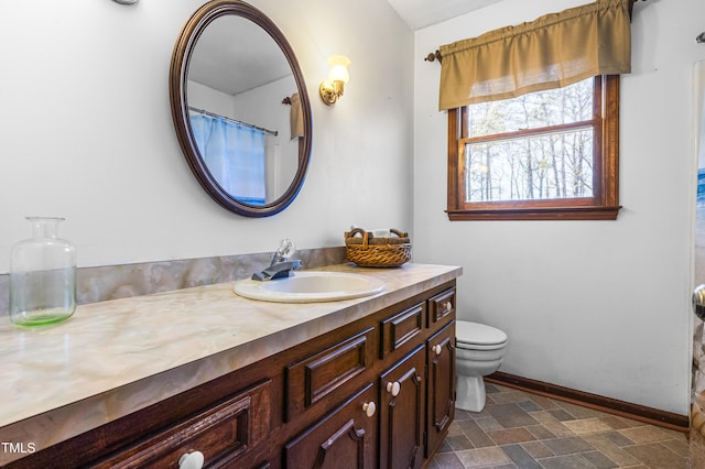 bathroom with toilet and vanity