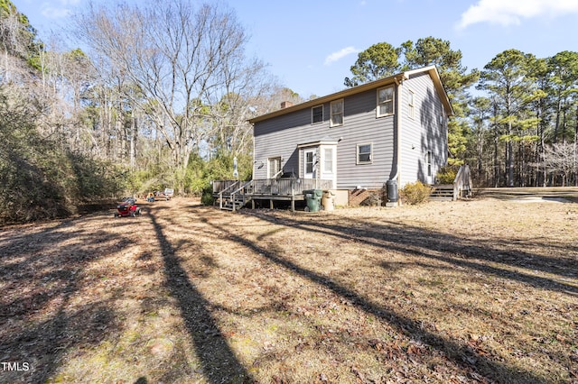 back of property featuring a deck