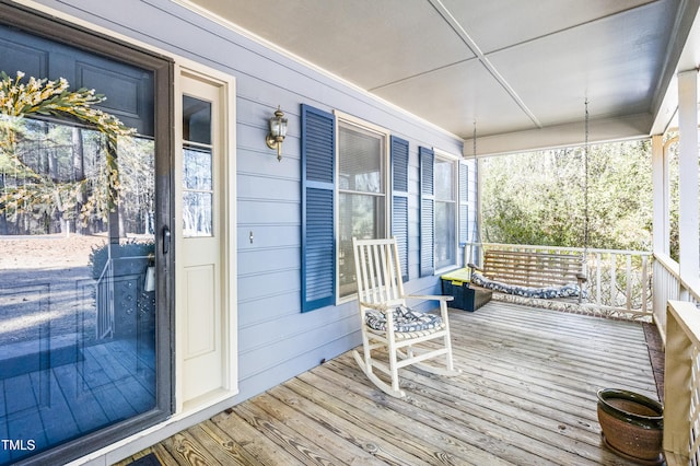 wooden terrace featuring a porch