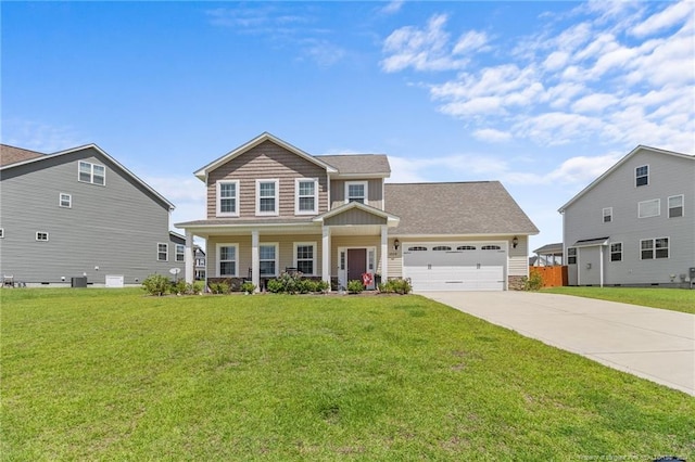 view of front of house with a front lawn, a garage, and covered porch