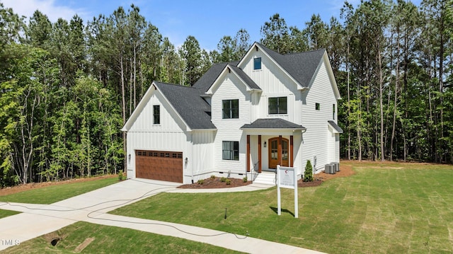 100 N Ridge View Way, Franklinton, NC 27525 - modern farmhouse with board and batten siding, driveway, a garage, and a front lawn