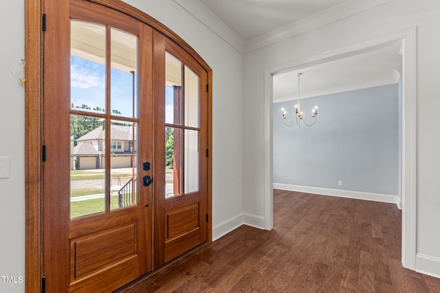 100 N Ridge View Way, Franklinton, NC 27525 - foyer with french doors, a chandelier, dark wood-type flooring, baseboards, and crown molding