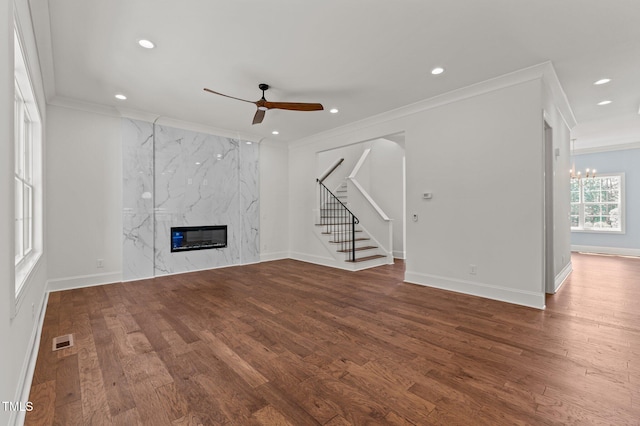 100 N Ridge View Way, Franklinton, NC 27525 - unfurnished living room featuring a ceiling fan, crown molding, stairs, wood finished floors, and recessed lighting