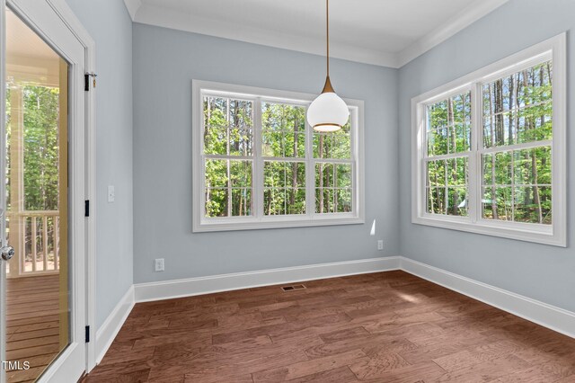 100 N Ridge View Way, Franklinton, NC 27525 - unfurnished dining area with dark wood-style floors, baseboards, and ornamental molding