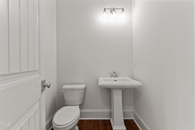 100 N Ridge View Way, Franklinton, NC 27525 - half bath with toilet, wood finished floors, baseboards, and a sink