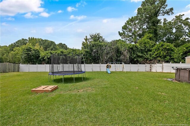 view of yard featuring a trampoline