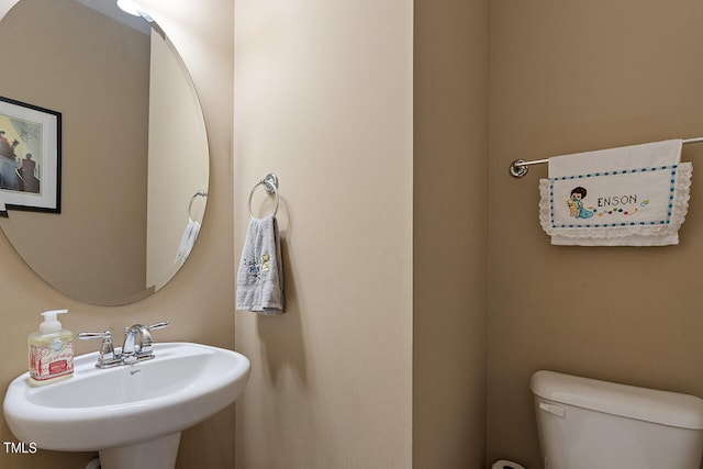 bathroom featuring sink and toilet