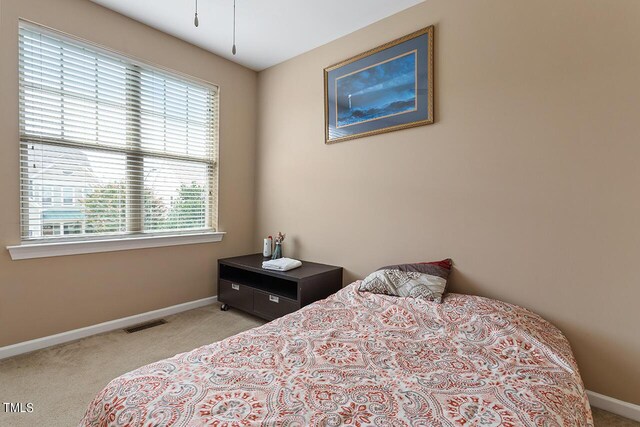 bedroom with light carpet