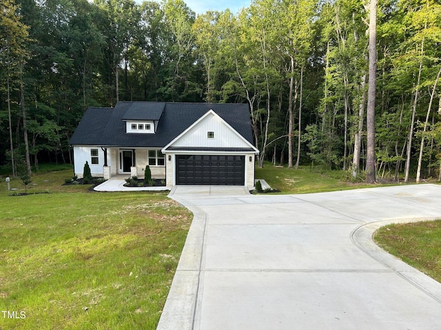 modern farmhouse style home with a garage and a front lawn