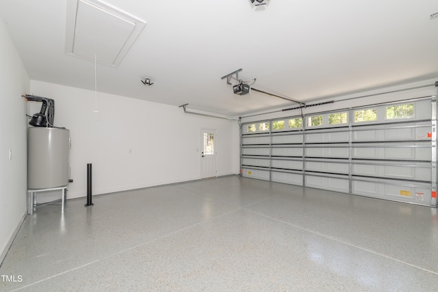 garage featuring a garage door opener and water heater