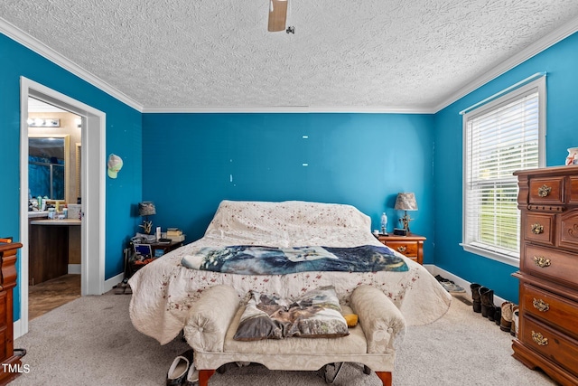 bedroom featuring ornamental molding, connected bathroom, a textured ceiling, carpet flooring, and ceiling fan