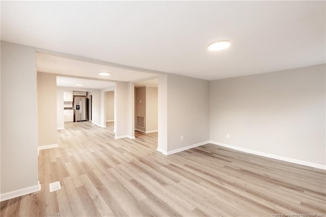 unfurnished room featuring light hardwood / wood-style flooring