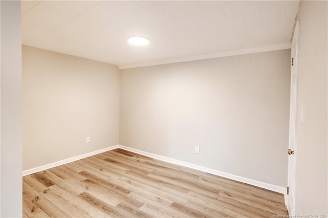 empty room with light hardwood / wood-style flooring