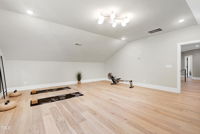 additional living space featuring lofted ceiling, light wood-style floors, visible vents, and recessed lighting