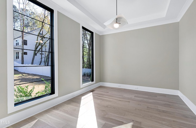 unfurnished dining area with ornamental molding and light hardwood / wood-style flooring