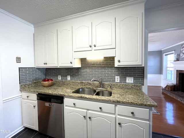 kitchen featuring white cabinetry, sink, stainless steel dishwasher, and ornamental molding