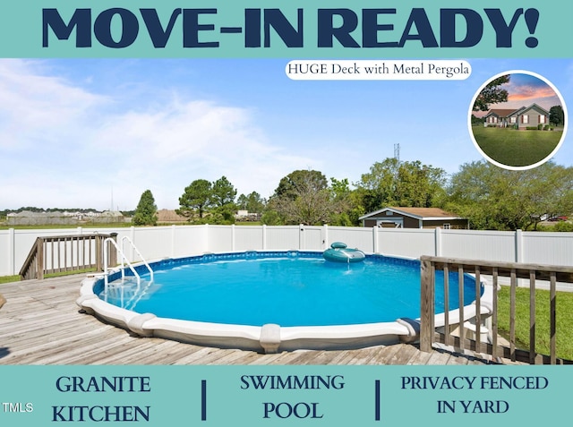 view of pool with a wooden deck