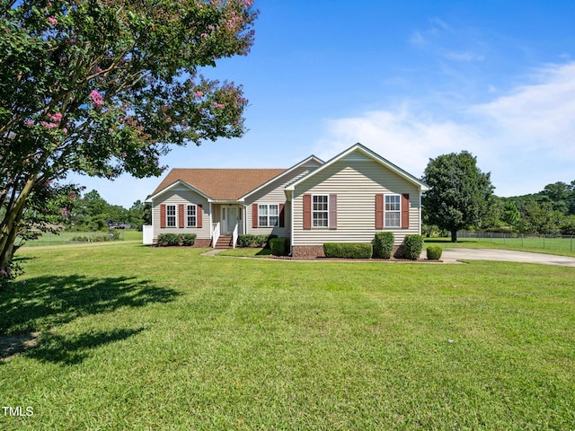 single story home featuring a front yard