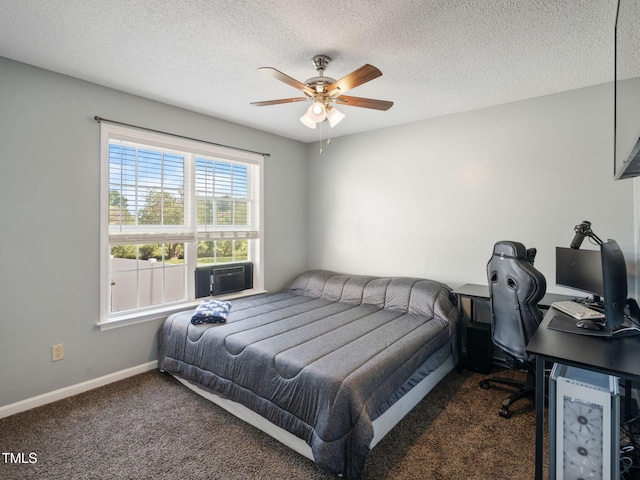 carpeted bedroom with cooling unit, baseboards, a textured ceiling, and ceiling fan