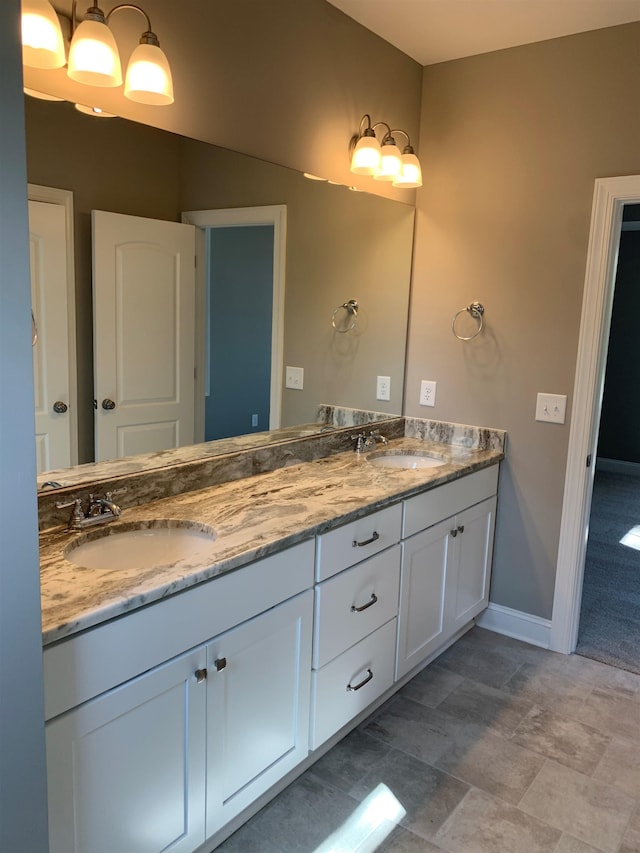 bathroom with tile patterned flooring and vanity