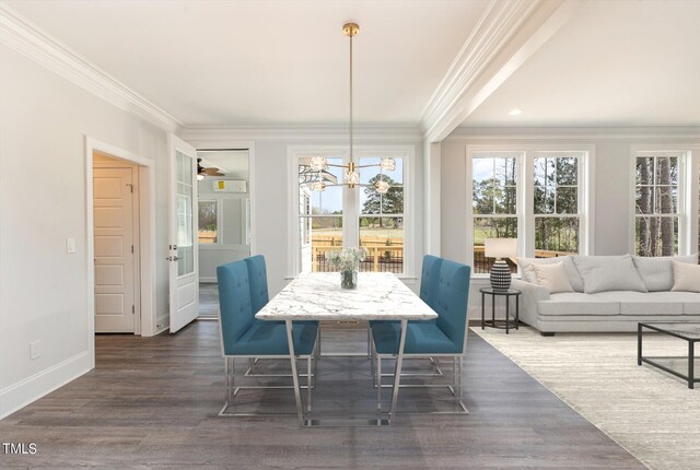 dining space with ceiling fan with notable chandelier, dark hardwood / wood-style floors, and ornamental molding