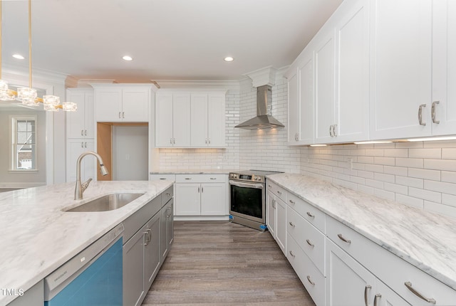 kitchen featuring crown molding, wall chimney range hood, dishwashing machine, stainless steel range with electric cooktop, and a sink