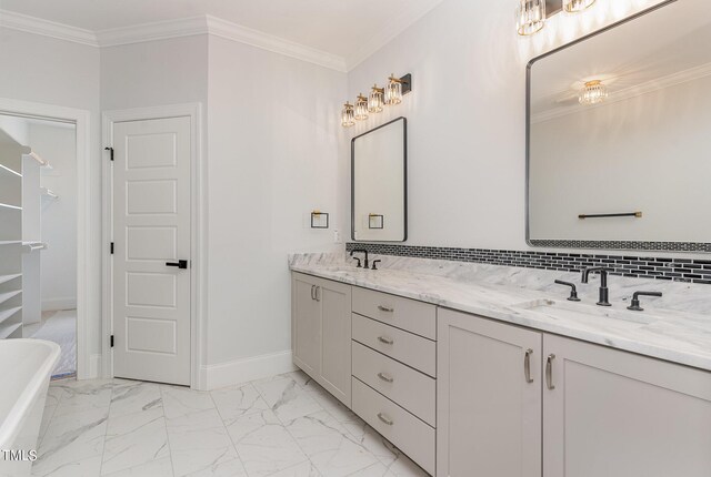 bathroom with vanity, a tub to relax in, crown molding, and tasteful backsplash