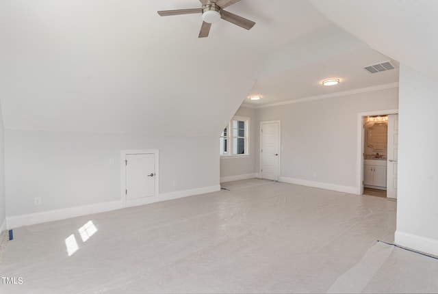 interior space with ceiling fan, light colored carpet, and lofted ceiling