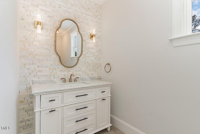 bathroom featuring vanity and baseboards