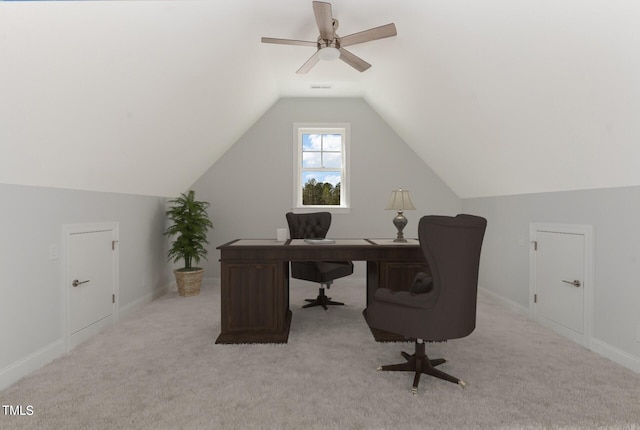 carpeted office featuring vaulted ceiling and ceiling fan