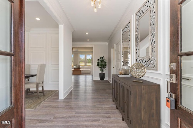 600 Darian Woods Dr, Holly Springs, NC 27540 - entryway with ornamental molding, wood finished floors, and recessed lighting
