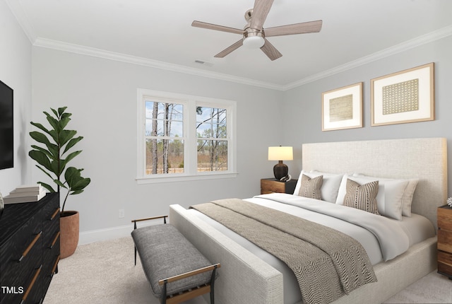 carpeted bedroom featuring ceiling fan and crown molding