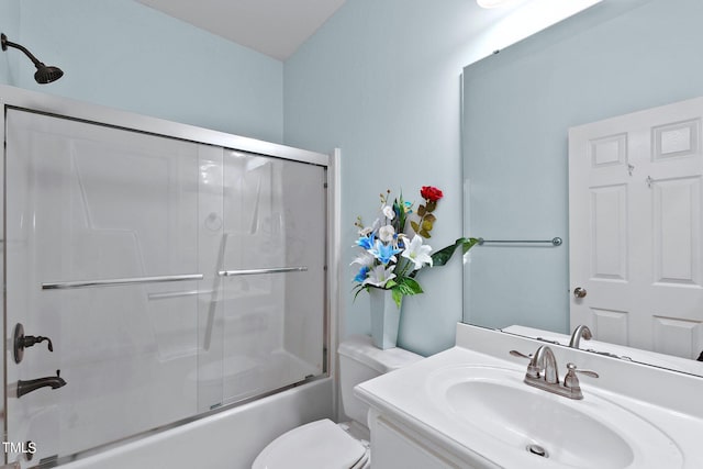 full bath with combined bath / shower with glass door, vanity, and toilet