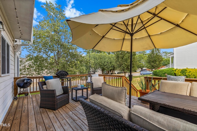 wooden deck featuring an outdoor hangout area and grilling area