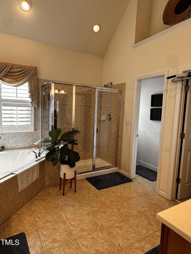 bathroom with vanity, lofted ceiling, plus walk in shower, and tile patterned floors