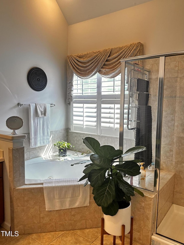 bathroom featuring shower with separate bathtub and tile patterned floors