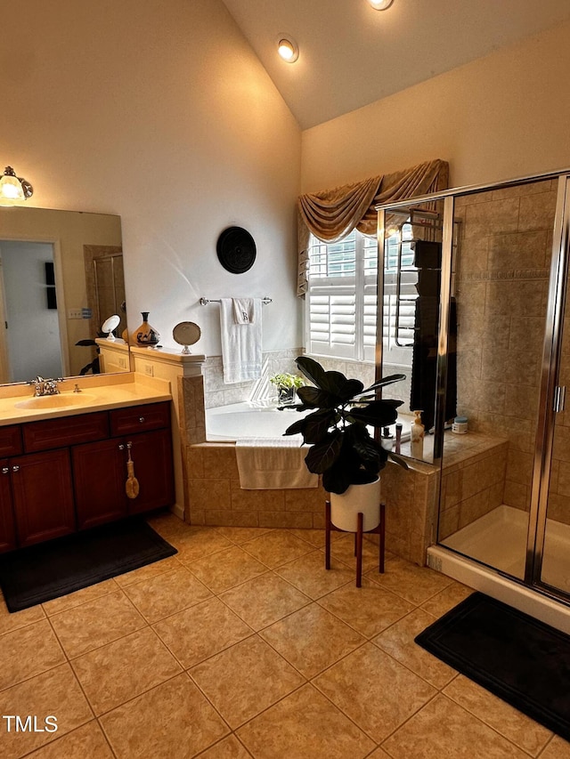 bathroom featuring vanity, high vaulted ceiling, tile patterned floors, and shower with separate bathtub