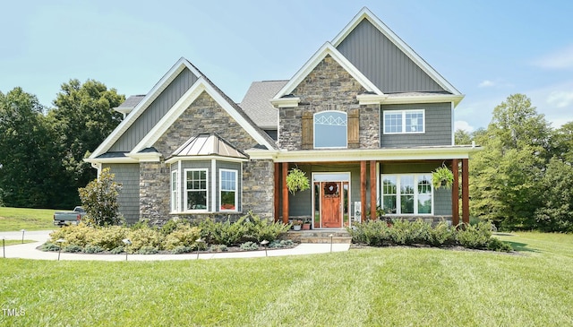 craftsman-style house with covered porch and a front yard