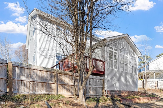 view of home's exterior with fence