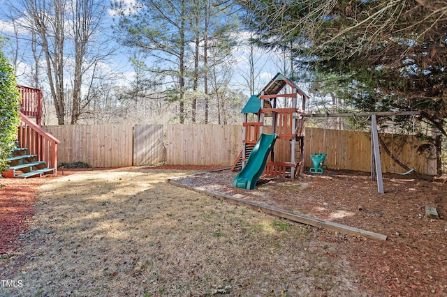 view of playground featuring fence