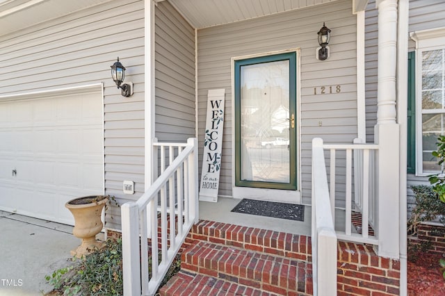 doorway to property with an attached garage