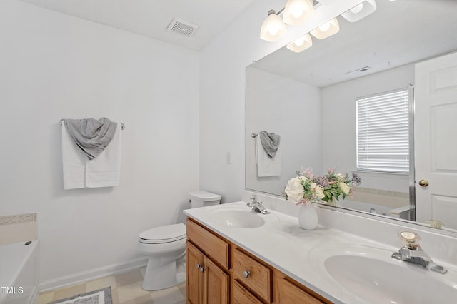 bathroom with a bath, toilet, a sink, and visible vents