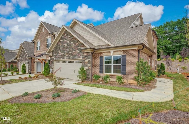 craftsman house with a front yard and a garage