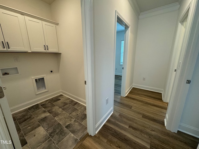 washroom featuring dark hardwood / wood-style floors, electric dryer hookup, washer hookup, and cabinets