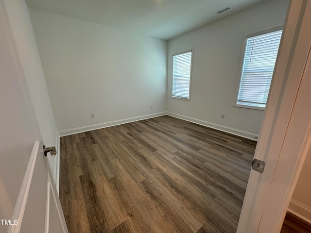 spare room featuring hardwood / wood-style flooring