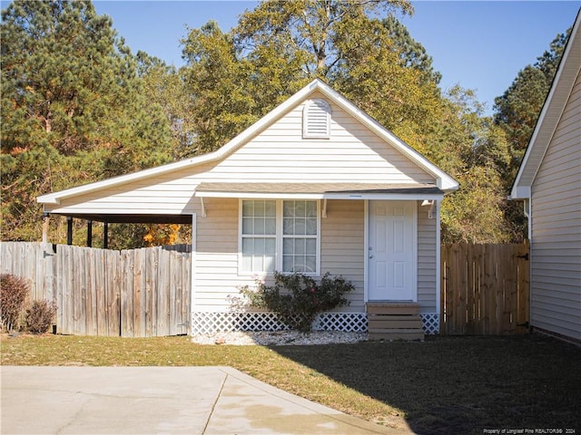 bungalow featuring a carport