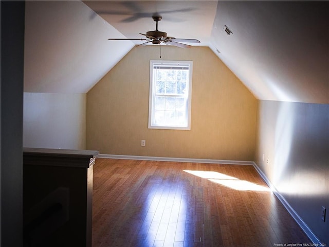 additional living space with hardwood / wood-style floors, ceiling fan, and lofted ceiling