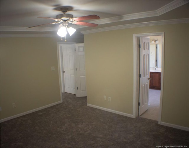 unfurnished bedroom with connected bathroom, ceiling fan, carpet, and ornamental molding