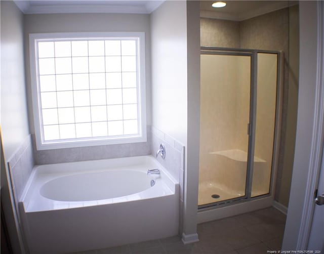 bathroom featuring tile patterned floors and independent shower and bath